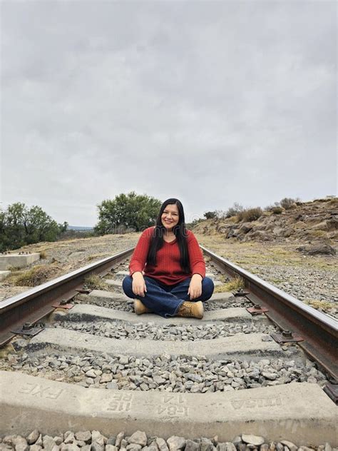 Year Old Latina Woman Sitting On Train Tracks Discovers And Explores As A Tourist Alone Stock