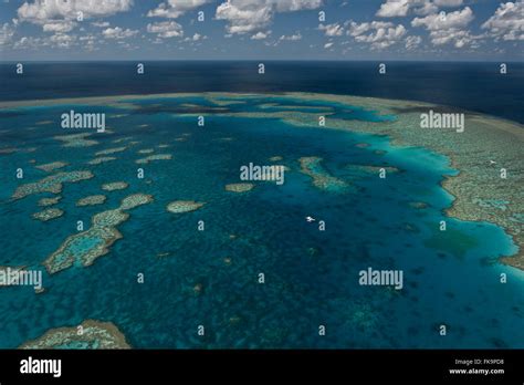 Aerial View Of Hardy Reef With Float Plane Home To The Heart Reef In