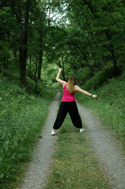 Premium Photo Blonde Walks Through The Woods