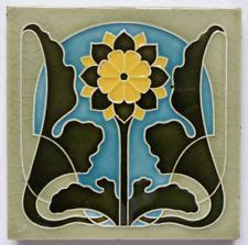 An Art Nouveau Tile Design With Flowers And Leaves On The Bottom In