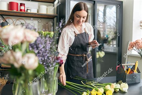 Photo Of Successful Modern Florist Wearing Apron Creating Beautiful