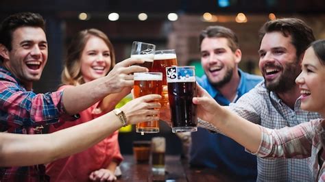 Premium Photo Group Of Happy Friends Cheering With Beer Glasses