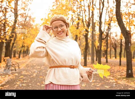 Beautiful Mature Woman In Autumn Park Stock Photo Alamy