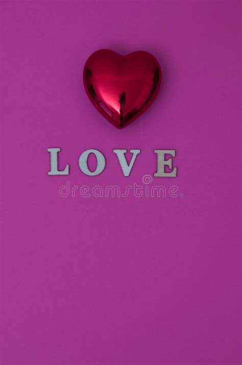 The Word Love On A Pink Background With A Red Heart Minimalistic Love