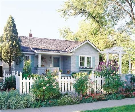 Landscaping With Picket Fence Blooming Shrubs And A White Picket