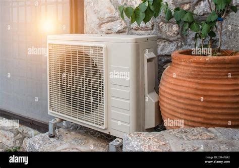 Air Heat Pump Outdoor Unit Against Wall Of Greek House Stock Photo Alamy