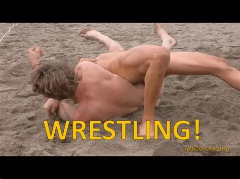 Two Naked Guys Are Wrestling Clothing Free At A Beach Festival Also