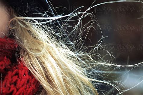 Girl With Blonde Hair Blowing In The Wind By Stocksy Contributor