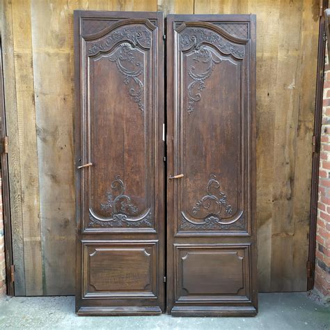 Moulded oak double door late 19th century Matériaux Authentiques