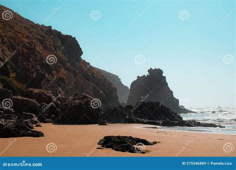 Rugged Cliff Face And Rock Formations Of Aftas Beach In The Chill