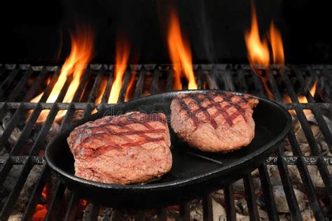 Two Beef Steaks On The Hot BBQ Flaming Grill Stock Image Image Of