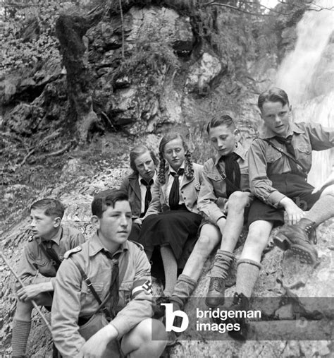 Image of Hitler youth boys and BdM girls sitting near cascades at