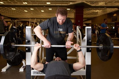 A Risky Weightlifting Courtesy Spotting For A Bench Press Wsj