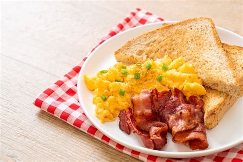 Premium Photo Scrambled Egg With Bread Toasted And Bacon For Breakfast