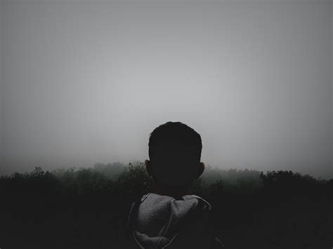 Premium Photo Rear View Of Man Standing Against Clear Sky