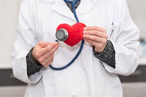 Cardiologist Checking Red Heart With Stethoscope Cardiology Con Stock