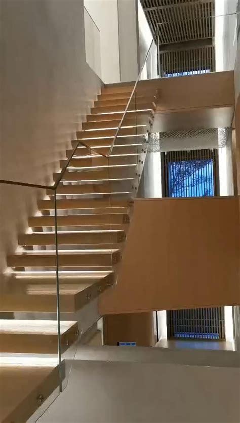 A Cantilever Or Floating Staircase With Oak Treads And Glass Balustrade