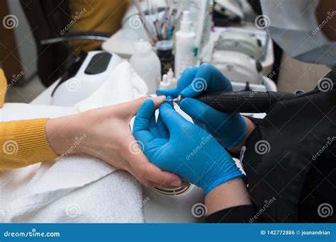 Close Up Of Professional Finger Nail Treatment Grinding And Polishing