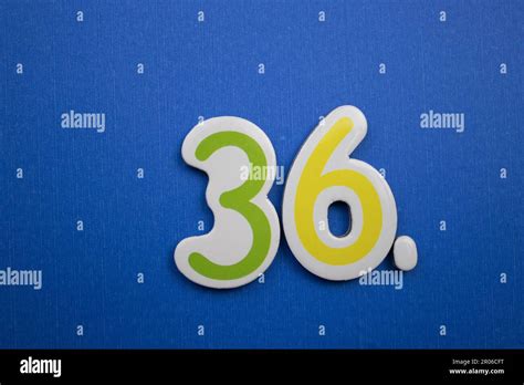 The number 36, placed on a blue background, photographed from above ...