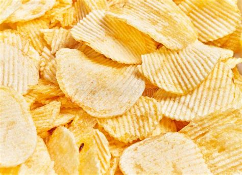 Close Up View Of Crispy Salty Potato Chips Texture Implying A Concept