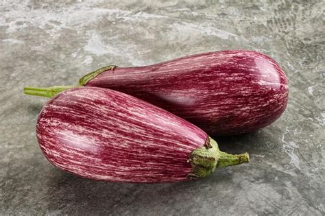 Premium Photo Two Ripe Purple Graffiti Eggplant For Cooking