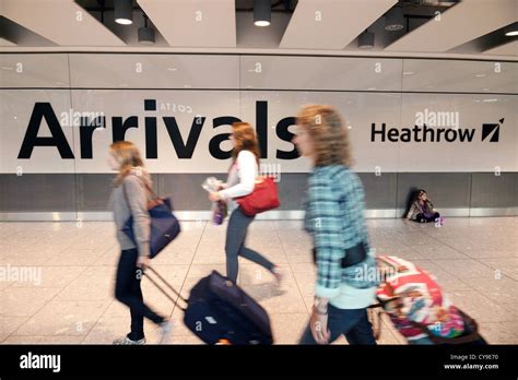 Air passengers arriving at Arrivals, Terminal 5 T5, Heathrow airport ...