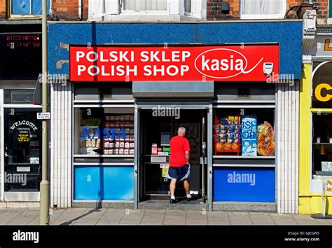 Man Walking Into Polish Shop In Scarborough North Yorkshire England