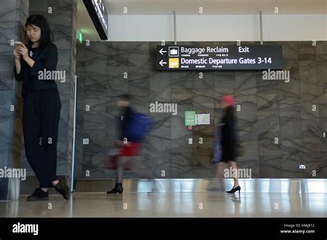 Passengers Head For The Domestic Departures Gate At An Airport Slow Shutter Speed For Blurred