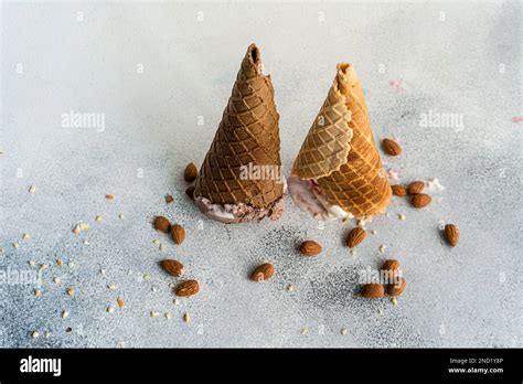 Upside Down Waffle Cones With Ice Cream On Concrete Background Stock