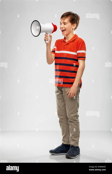 Boy Speaking To Megaphone Stock Photo Alamy