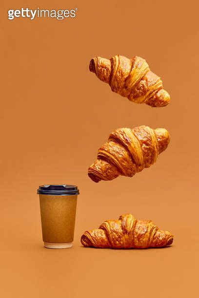 Levitating Food Crispy Fresh Croissants Flying Over Coffee Cup To Go