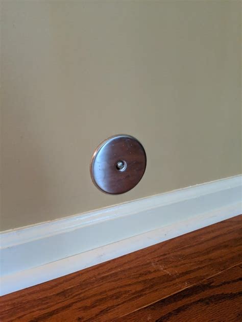 This Weird Metal Cap Thing On My Wall Near The Floor With A Single