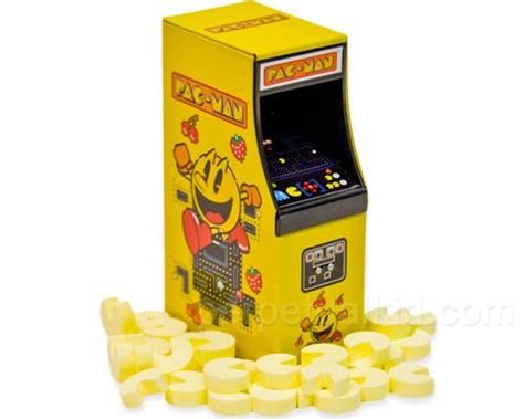 A Yellow Arcade Game Machine Surrounded By Pieces Of White Diced Up