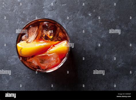 Negroni Cocktail On Dark Stone Table Top View With Space For Your Text