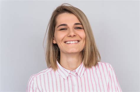 Closeup Portrait Of Positive Smiling Blonde Female With Attractive Look