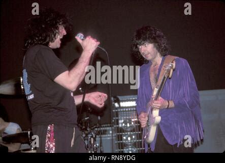 Deep Purple band members are shown performing together during a "live ...