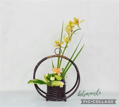 A Basket Filled With Flowers Sitting On Top Of A Table