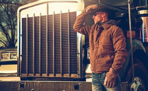 Premium Photo Caucasian American Semi Truck Driver In Front Of A Vehicle