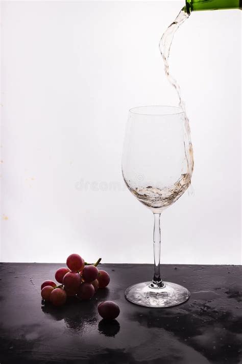 Flowing Wine On White Background And Grape Stock Photo Image Of