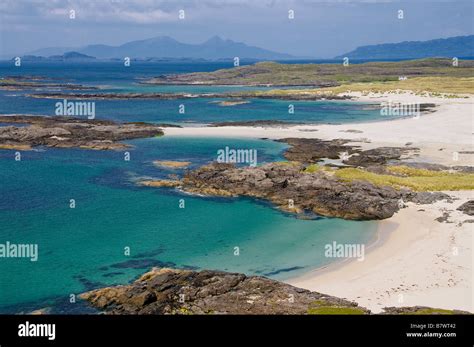 View of the beaches at Sanna Bay Ardnamurchan from the hills above with blue sea and coral sands ...