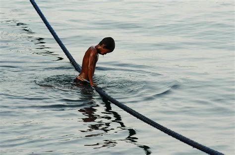 A Filipino Boy Swimming At The Port Of Puerto Galera Smithsonian