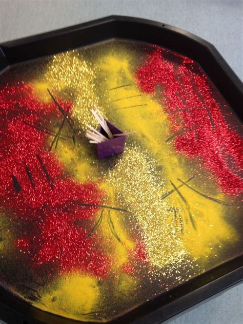 An Artistically Designed Tray With Red And Yellow Paint