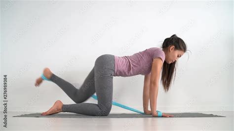 Resistance Band Fitness Girl Doing Leg Workout Donkey Kick Floor