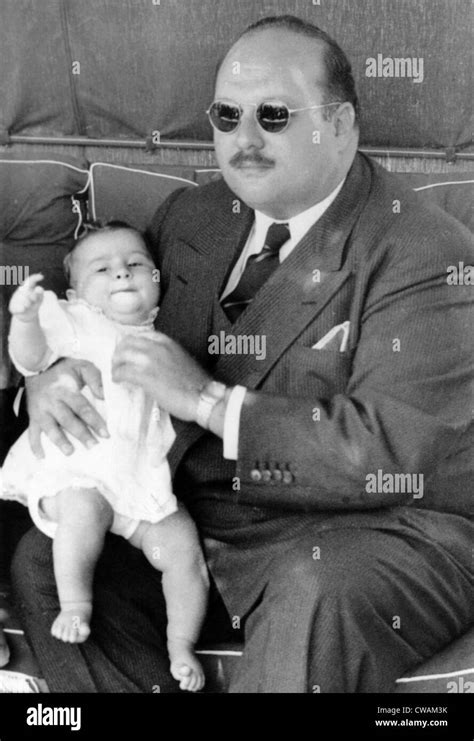 Former King Farouk of Egypt holding baby Prince Ahmed Fouad, Italy ...