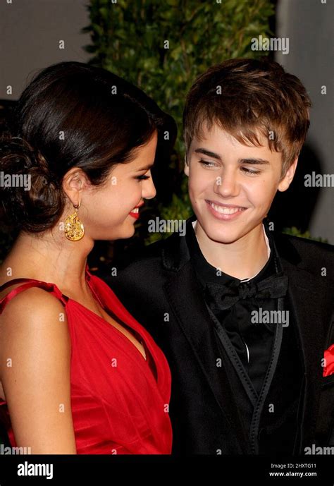 Selena Gomez And Justin Bieber Attending The 2011 Vanity Fair Oscar Party Hosted By Graydon