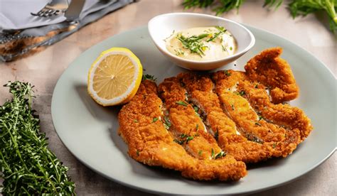 Crispy Elegance Pork Schnitzel With Dill Sauce Delight