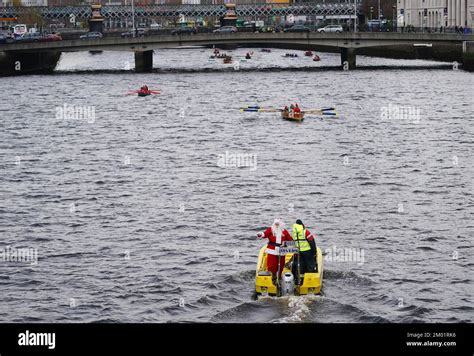 A Man Dressed As Santa Supports Participants In The ‘all In A Row