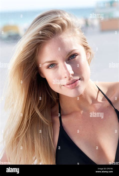 Female With Long Straight Blonde Hair Wearing Black Bikini Unsmiling