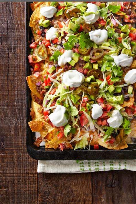 Best Loaded Nachos Recipe - How to Make Loaded Nachos - CountryLiving.com