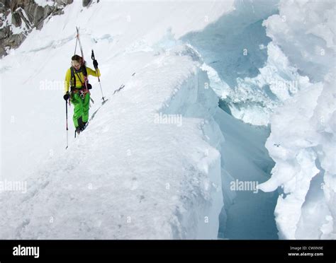 Skier about to cross the bergschrund, Glacier Milieu, Aiguille ...